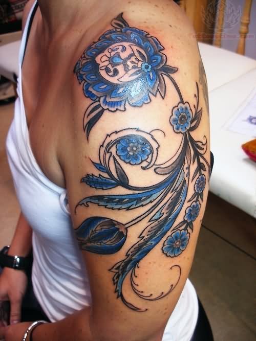 Blue Ink Flowers Paisley Pattern Tattoo On Left Shoulder